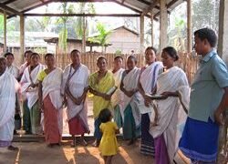 SHG members at a weekly meet at Polasong village with awareness leaflets at Polasong village