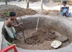 Beneficiary involved in earth excavation, a capacity building exercise