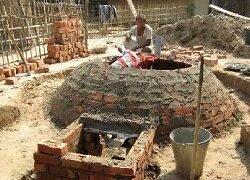 Sealing the exterior portion of the dome with earth material