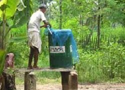 Fixing a low cost strainer made of mosquito net to the water holding tank