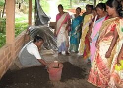 Manual sieving of bio-compost material being demonstrated to the groups