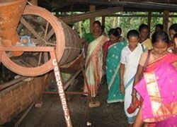 A mechanical sieve used for sieving bio-compost being operated by the group members